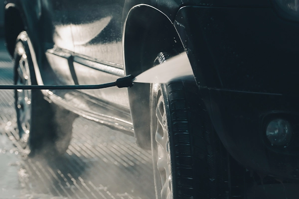 Cleaning undercarriage of vehicle